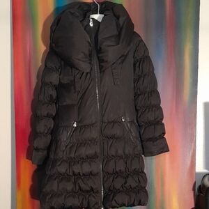 Long Black Puffer Jacket with High Collar and Quilted Design